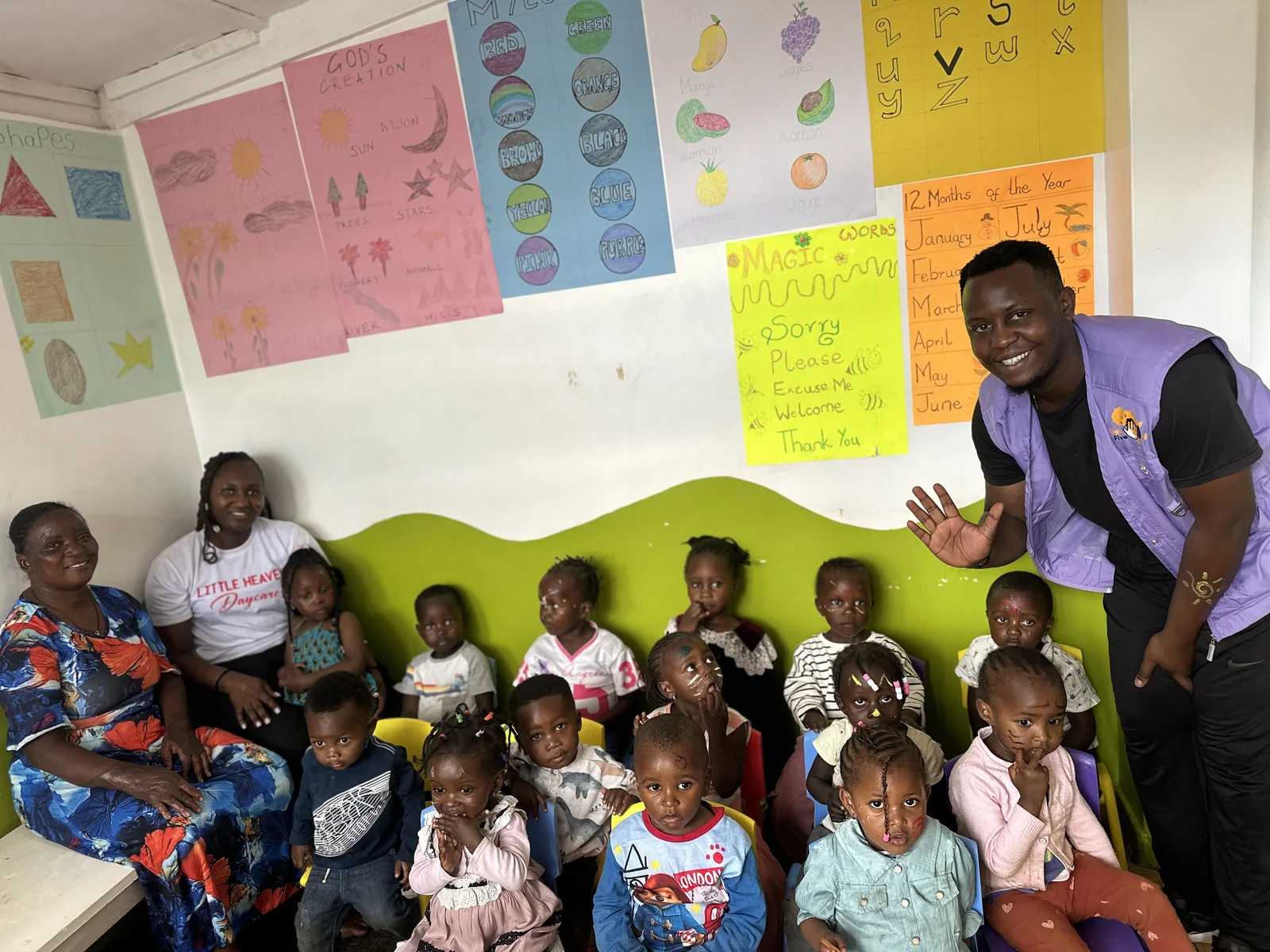 Children and a caregiver gathered together at Little Heaven