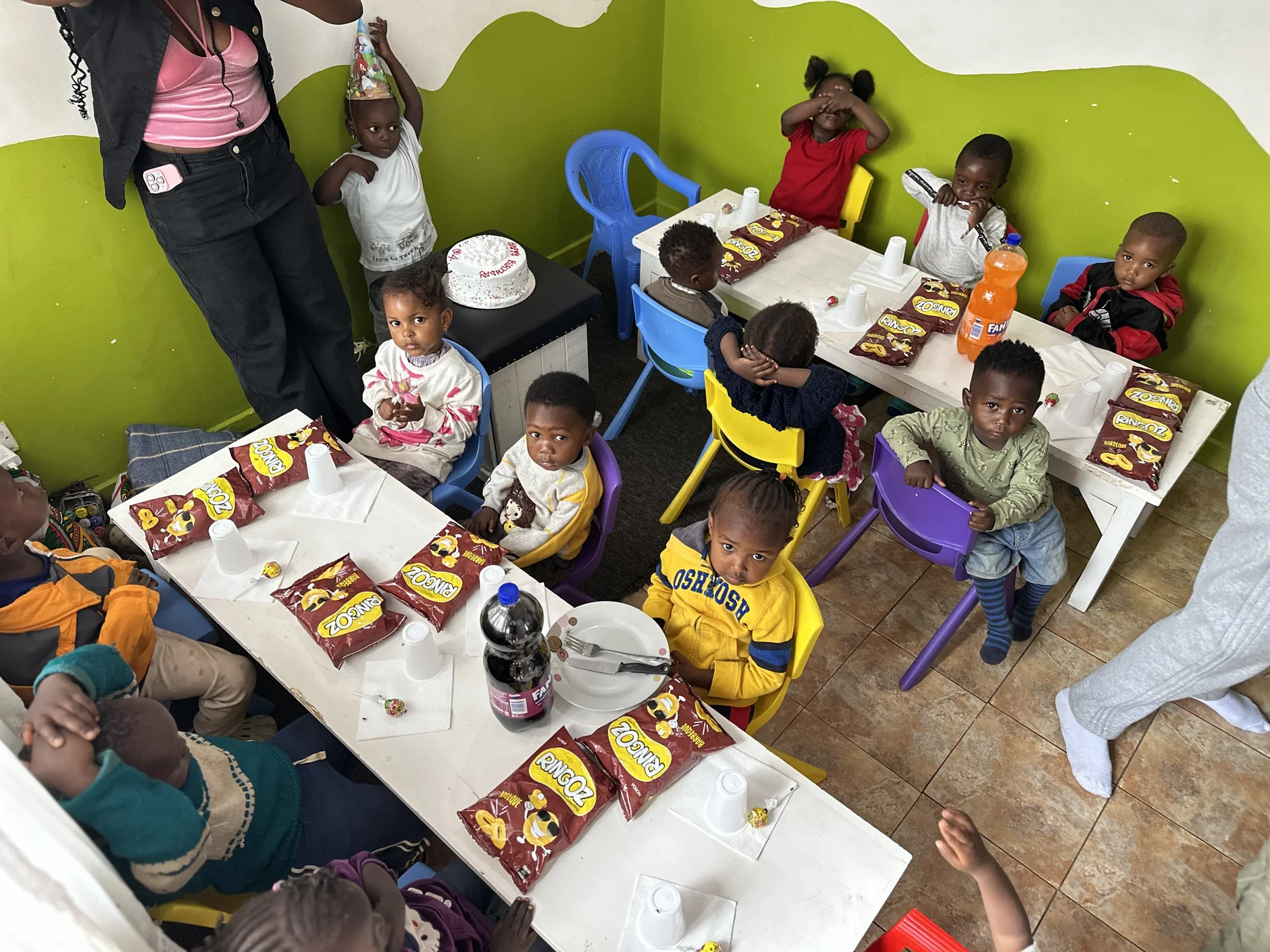 Children gathered for a birthday celebration at Little Heaven