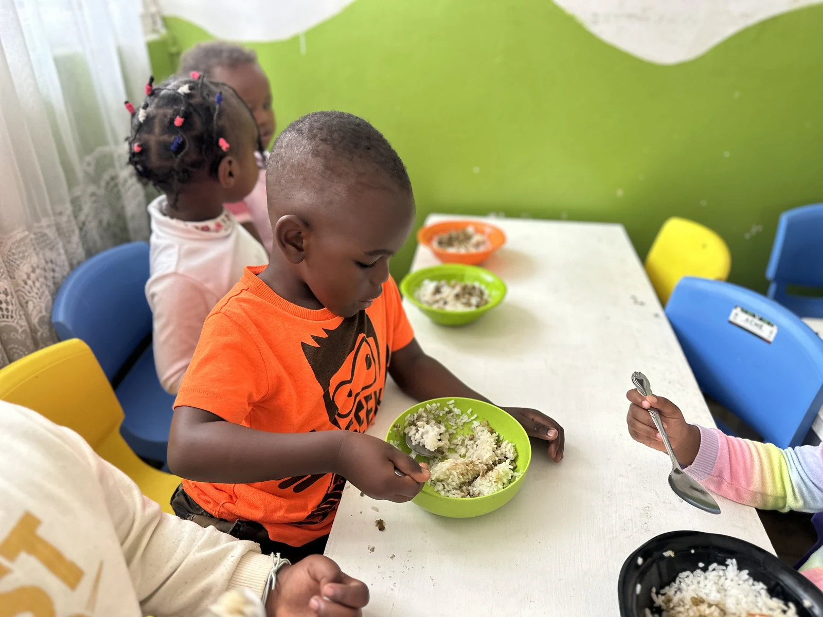 Children sharing a meal together at Little Heaven